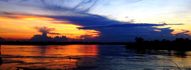 sunset over rio napo in mazan peru